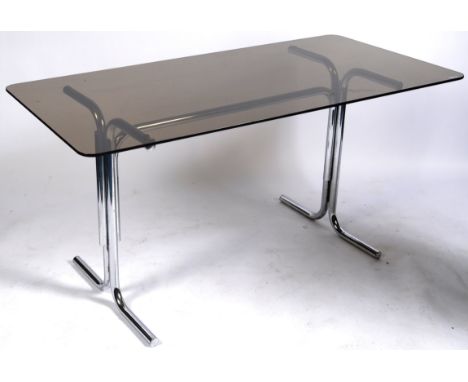 A retro vintage 20th Century British design chrome and glass top dining table having a rounded edge rectangular smokie glass 