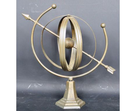 A vintage 20th century armillery sphere / orrery having a single globe to the centre with an arrow through the centre raised 