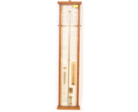 A vintage 20th century Admiral Fitzroys mercury barometer having atmosphere valve and thermometer within a glazed oak case. 9
