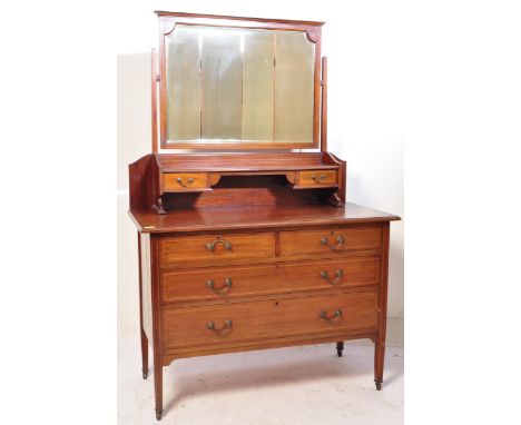 An Edwardian solid mahogany dressing table chest. The dressing table having a single mirror with flared cornice over an inlai