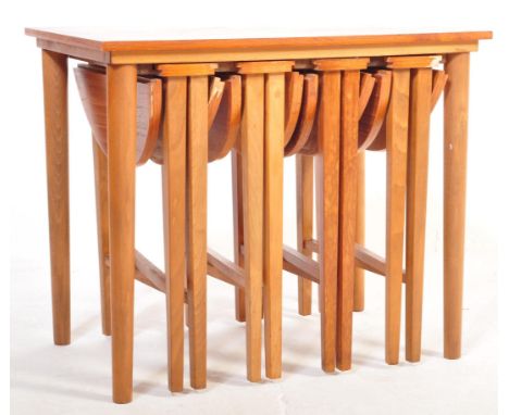 
A retro vintage 1970's Danish inspired drop leaf teak veneered quartetto nest of tables featuring 3 drop leaf tables underne