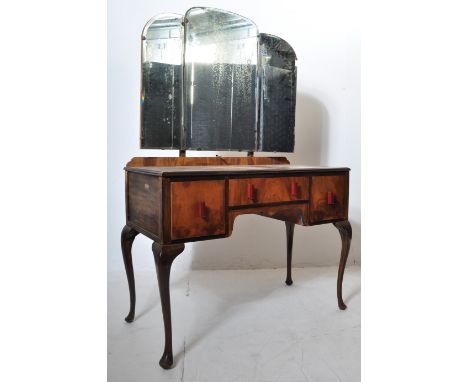 A 1940s 20th century walnut Queen Anne revival dressing table. The dressing table having a triptych mirror over a single draw