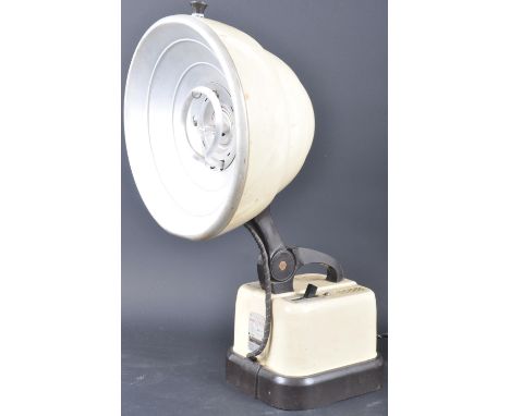 A retro vintage mid 20th century Hanovia portable ultraviolet heat lamp having a beehive shaped light shade, carry handle to 