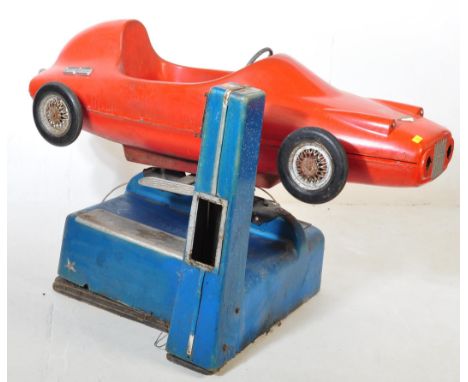 A mid 20th century retro circa. 1960s R. G. Mitchell coin operated amusement arcade racing car Kiddie-Ride. Headlights remove