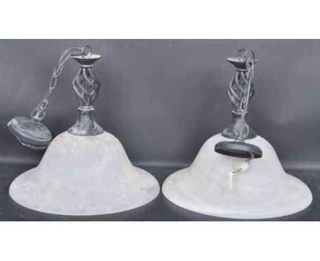 A pair of 20th century glass ceiling light shade having an ebonised spiral fixture with a flared frosted glass shade.&nbsp;