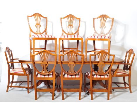 A large, good quality regency&nbsp; revival 20th century yew wood pedestal dining rooms suite. The suite comprising a large p