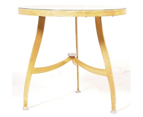 A mid century, circa 1950's Italian space race / age sputnik atomic style occasional table. The table with wrought and cast m