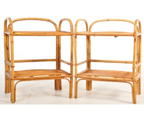 A pair of mid-century retro bamboo bedside tables having twin tiers with arched gallery edges to the table top. Together with