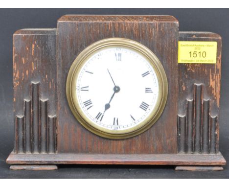 A 1930s circa. Art Deco Goldsmiths and Silversmiths mantle clock having enamelled face marked 'Goldsmiths and Silversmiths, 1
