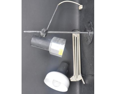 A retro vintage mid 20th century desktop lamp having a conical lightshade with adjustable rise and fall support raise on a ci