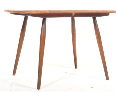 Ercol - Lucien Ercolani - A retro vintage mid 20th century elm side / occasional /&nbsp; table having a chamfered edge raised