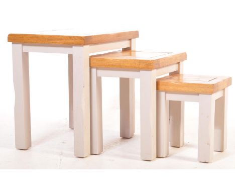 A contemporary Oak Furniture Land St Ives range chunky nest of tables of long rectangular form with inset ebonised border to 