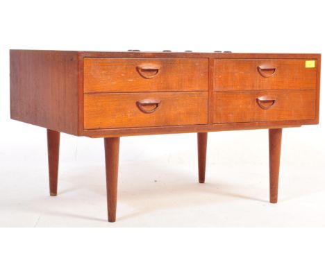 British Modern Design - A mid century teak wood coffee / occasional table. Raised on tapering turned legs supporting a rectan