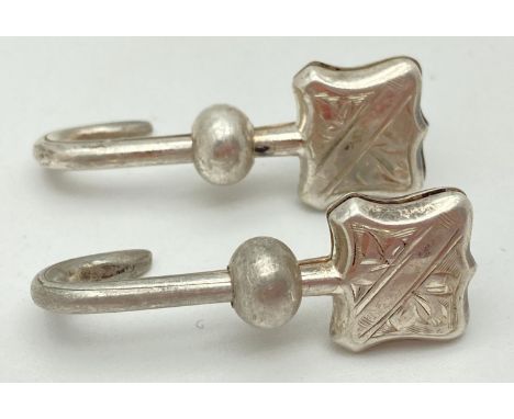 A pair of Art Deco silver napkin hooks with engraved detail to clips. Both hallmarked W.H. Collins &amp; Co, Birmingham 1933 