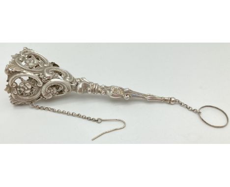 A 19th century German silver tussie-mussie posy holder complete with chain, pin and finger ring. Decorative square shaped bow