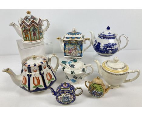 A collection of assorted vintage ceramic teapots. To include Sadler, Wade Rington's and Gibsons Nevin. 