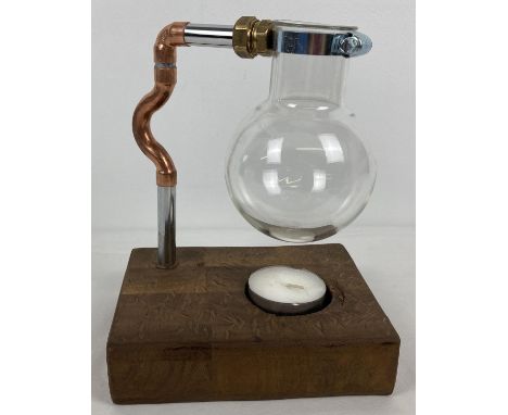 A modern rustic effect tea light oil burner made from a glass round bottom scientific flask. Approx. 25cm tall. 