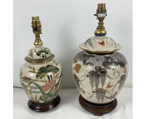 2 Oriental style ceramic lamp bases with gilt detailing and crackle glaze effect, mounted on wooden stands. One featuring but