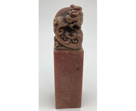 A Chinese soapstone seal with carved dragon shaped finial. Approx. 12cm tall. 