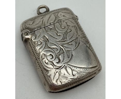 A late Victorian silver vesta case with engraved foliate &amp; scroll detail front &amp; back. Fully hallmarked to inner rim 