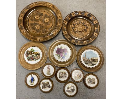 A collection of assorted vintage wooden framed ceramic plaques, in varying sizes. Together with 2 Black Forest carved wooden 