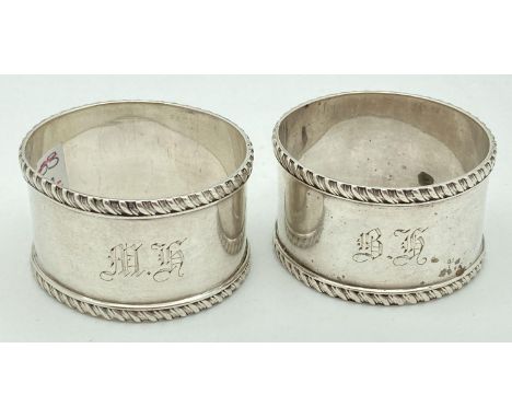 A pair of William Hutton &amp; sons Victorian silver napkin rings. Engraved monograms 'BH' &amp; 'MH'. Hallmarked London 1898