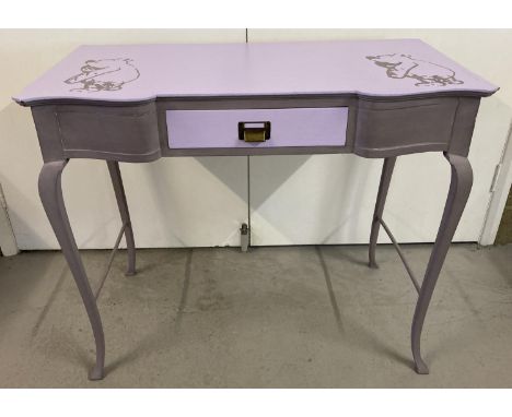 A vintage wooden console table/desk, painted in lilac tones and with Winnie-the-Pooh stencilled detail. With cabriole style l