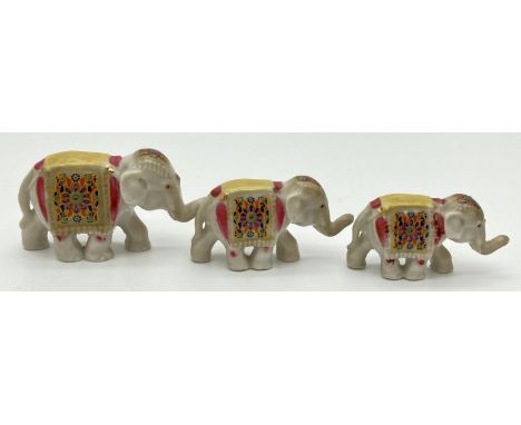 3 vintage 1950's Wade ceramic elephants from the Wade Treasures Elephant Train. Largest approx. 3.5cm tall. 