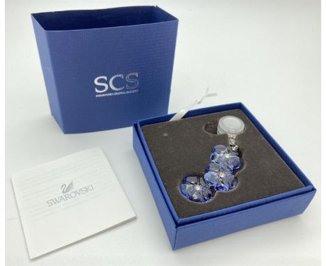 A boxed 2011 Swarovski Crystal Society pale lilac "Artic Flower" window/hanging crystal light catcher. Complete with outer sl
