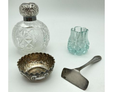 An early 20th century silver topped perfume bottle (stopper missing) together with 3 other vintage items. Comprising: a silve