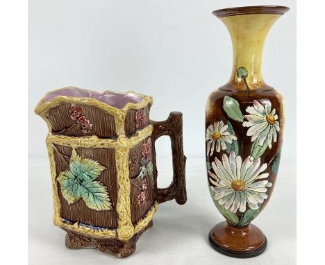 2 Victorian ceramic items, a hand painted vase together with a majolica jug. Vase with hand painted daisy decoration in brown