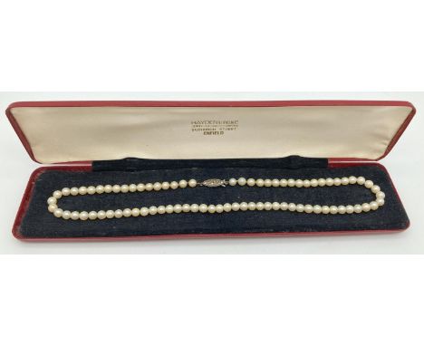 A boxed vintage pearl necklace, with silver clasp, set with marcasite stones. Approx. 16 inches long. 
