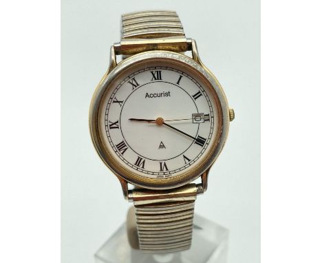 A men's vintage wristwatch by Accurist with gold tone stainless steel expanding strap. Roman numeral hour markers. Gold tone 