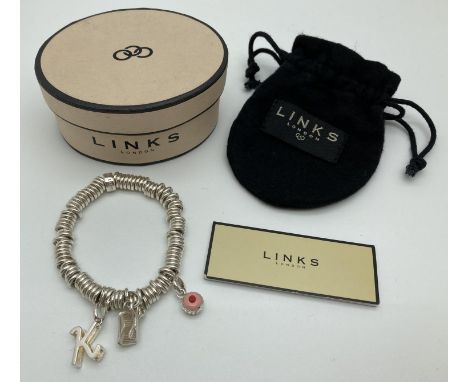 A Links Of London Sweetie bracelet with 3 charms. bracelet marked with Links of London name and logo. Charms comprise: initia