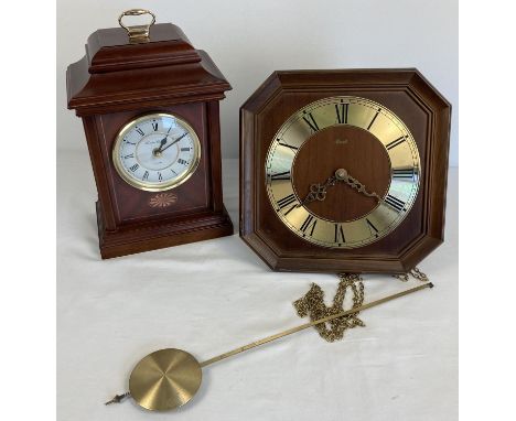 2 wooden cased clocks. A modern London Clock Co. glass panelled quartz mantel clock (approx. 32cm tall) together with a Germa