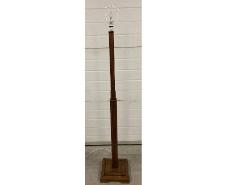 An Art Deco wooden standard lamp with square column detail and stepped base. Total height including light fixing. 157cm. 