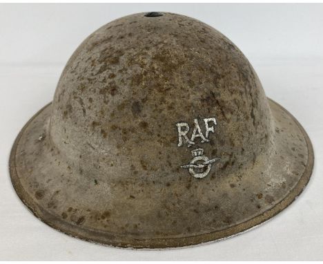 A British 1940 WWII MkII steel helmet with painted RAF monogram &amp; badge to front. With traces of painted formation sign t