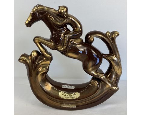 A vintage brown and gold glaze ceramic Apricot brandy decanter in the shape of a race horse and jockey. Produce exclusively f