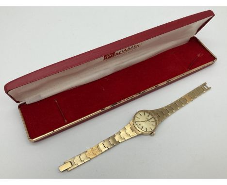 A ladies vintage gold tone bracelet wrist watch by Roamer. Oval shaped brushed pale gold face. In working order. With origina
