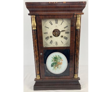An antique Seth Thomas American weight driven mantel clock housed in a dark wood veneer case. Original weights, winder and pe