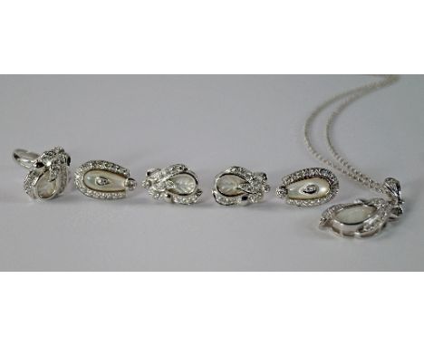 An 18ct white gold and mother of pearl parure, comprising pendant, earrings and ring, of leaf form, set with clear crystals, 