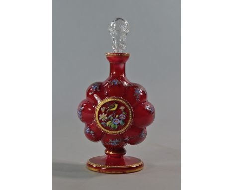 A Continental overlaid glass decanter and stopper, late 19th century, the body of lobed form with red ground, over enamelled 