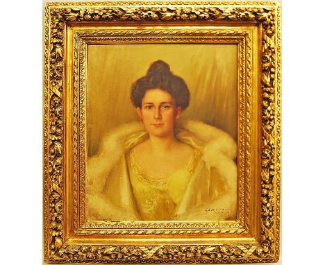 Georges C Michelet, French b.1873- Portrait of a lady, quarter-length in a yellow dress and hooded fur shawl; oil on canvas, 