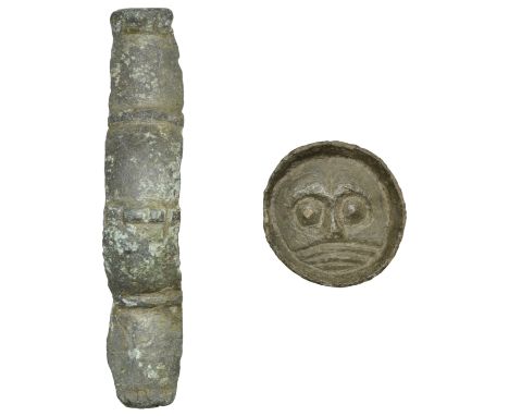 Anglo Saxon, mid 6th century, a bronze button brooch with upturned rim, face decorated with a chip carved anthropomorphic fac