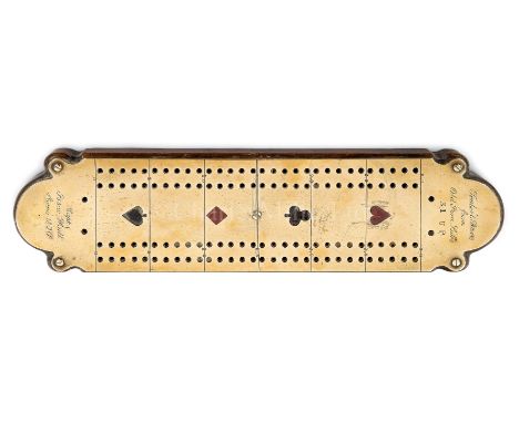 A CRIBBAGE BOARD MADE FROM THE U.S.S. CONSTITUTION the 1in. shaped timber section with brass plate secured to top with filled