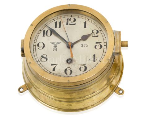 A KRIEGSMARINE BULKHEAD CLOCKthe 6in. silvered dial numbered '273' with KM mark, spade hands with sweep seconds, 8-day going 