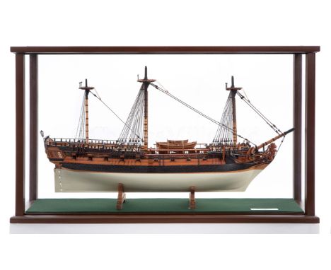 A FINELY CARVED AND PRESENTED 1:48 SCALE MODEL OF H.M.S. WAGER [1734]the planked and pinned 28in. hull painted white below th