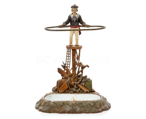 A NOVELTY MARINE-THEMED CAST IRON STICK STAND, PROBABLY FRENCH, CIRCA 1890modelled as a sailor standing on a fighting top wit