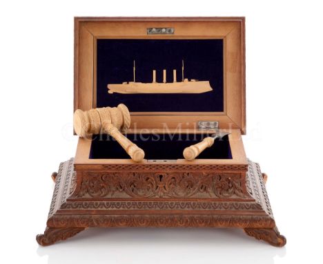 A FINE LAUNCHING CASKET FOR THE PROTECTED CRUISER H.M.S. ESSEX, 1901elaborately carved overall in oak, the lid with silver pl