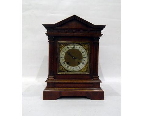 Victorian walnutwood mantel clock in architectural case, with brass dial, steel chapter ring, eight-day striking movement, 40